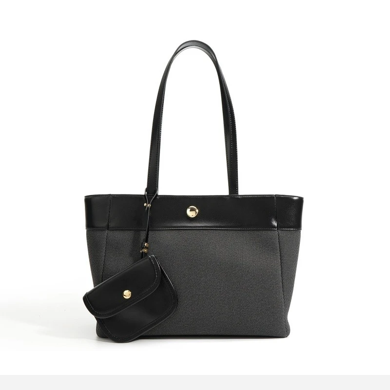 woman black leather work tote bag with charm